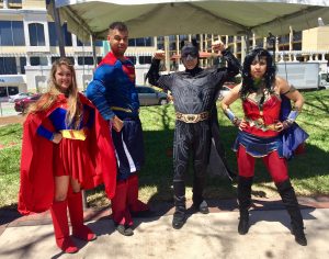 Scott and staff dressed as superheroes